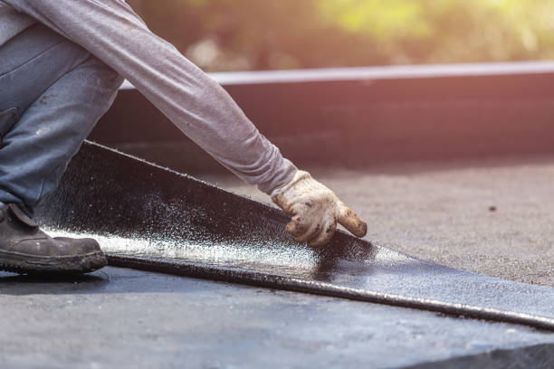 Professional Basement Waterproofing technician working in Norwalk, IA